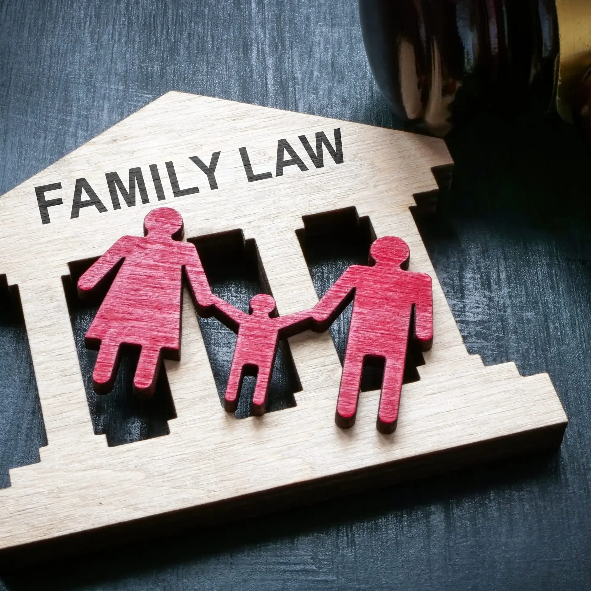 Gavel beside wooden Family Law house
